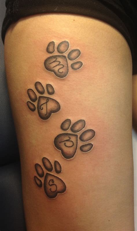 paw print tattoo ideas|paw print tattoo on thigh.